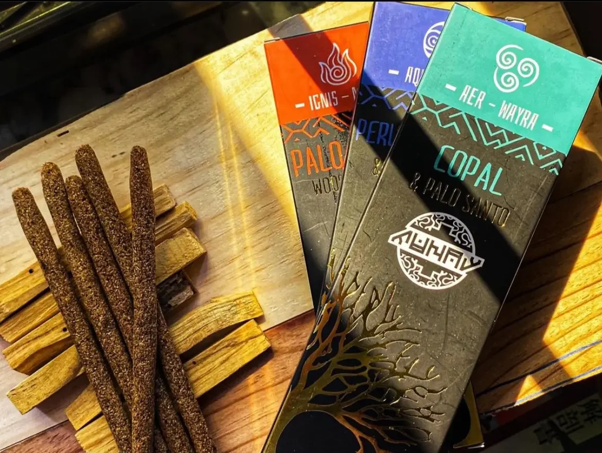 Palo Santo product next to raw palo santo