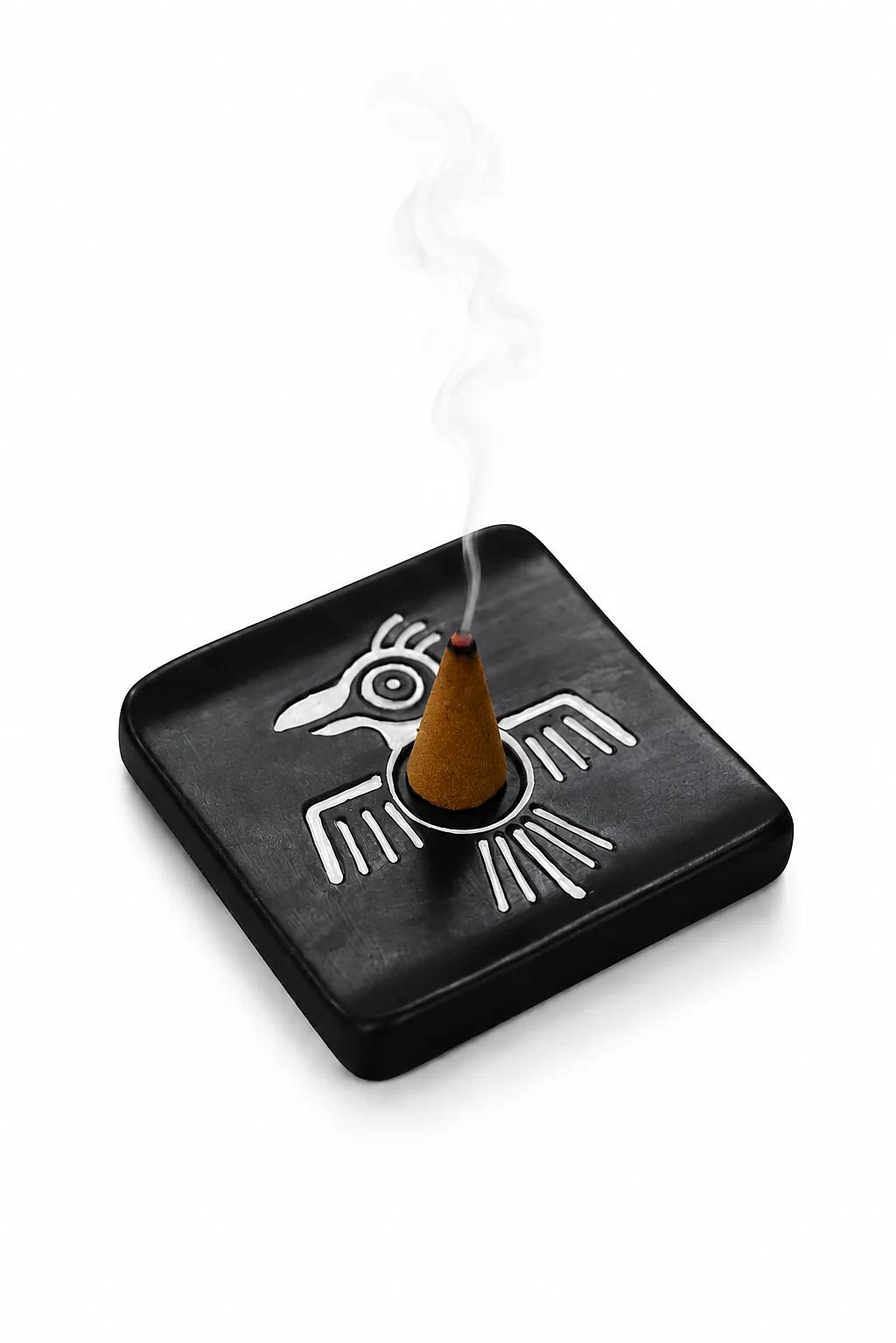 Munay Condor black ceramic incense cone burner with a burning cone, handmade in Peru